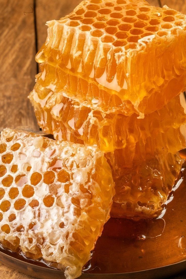 Golden honeycomb filled with raw honey